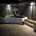 Garden makeover with plants, benches and lights